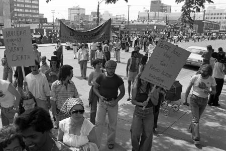 1977 Nuclear Protest, Saskatoon, SK 23rd Street 
Saskatoon Public Library under construction in background